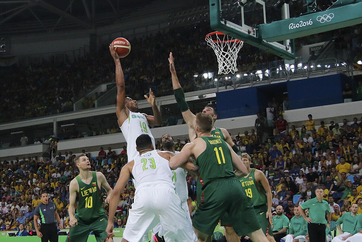Winning action sports photo showing a basketball player taking a game-winning shot